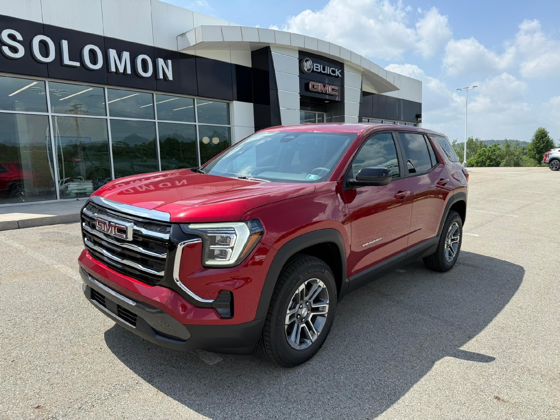 2027 GMC Terrain AWD Elevation in Volcanic Red Tintcoat — front three-quarter view