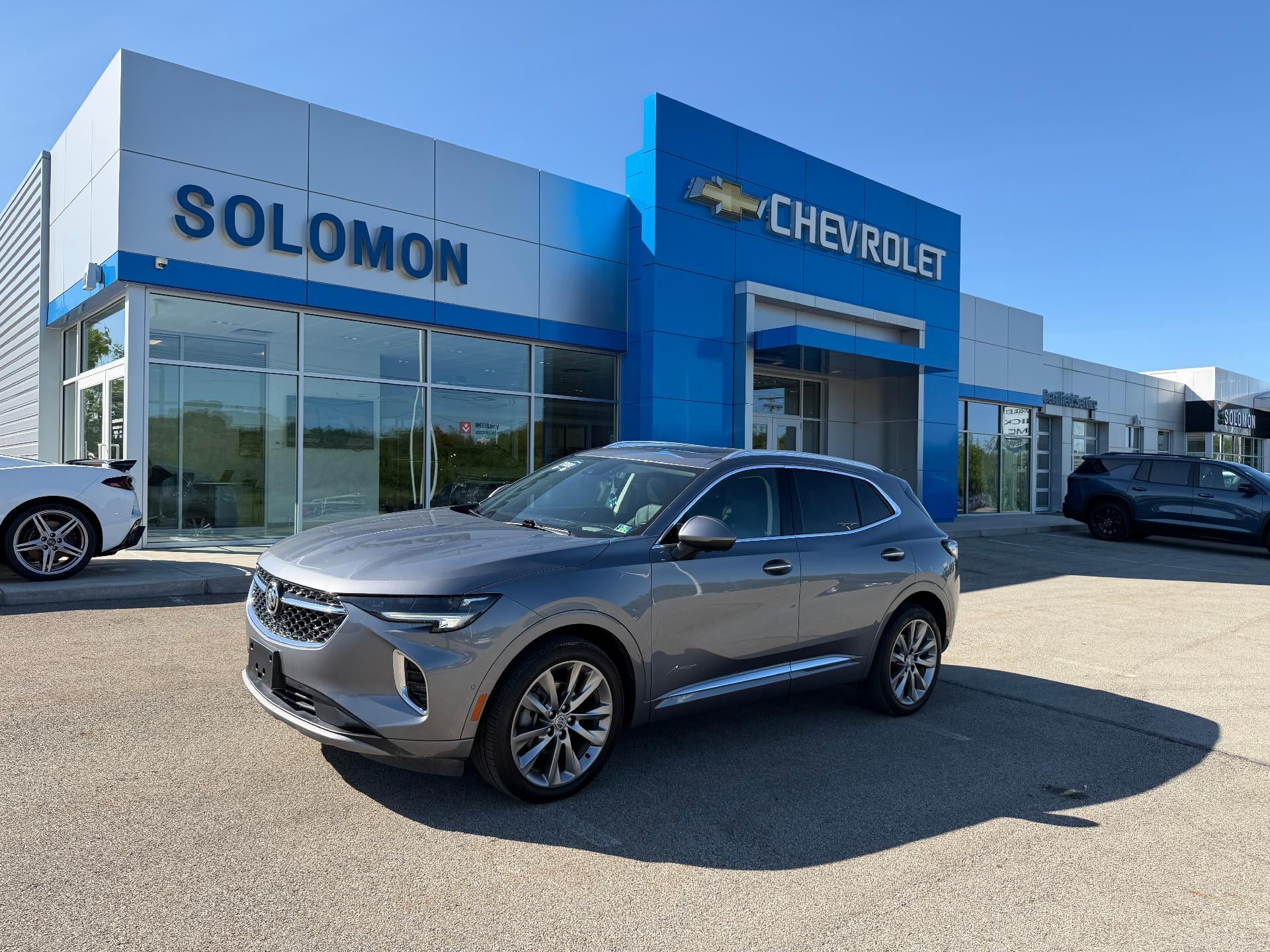 2022 Buick Envision Avenir in Satin Steel Metallic — front three-quarter view